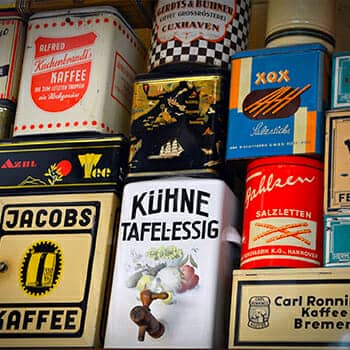 German professor feature image blog post with coffee cans with German branding and vocabulary