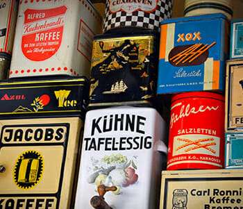 German professor feature image blog post with coffee cans with German branding and vocabulary