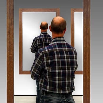 man in mirror to represent rote repetition feature image