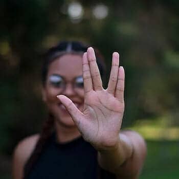 Master narrative of memorization feature image feature post with a woman giving the live long and prosper hand signal