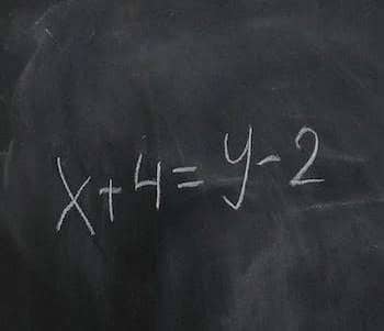 chalkboard with a math formula on it