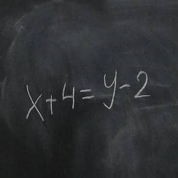 chalkboard with a math formula on it
