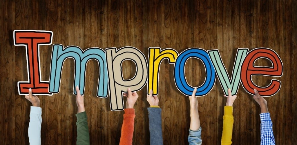 Image of the word "Improve" held up by hands