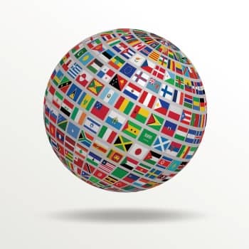 Image of a globe with many flags to express a Magnetic Memory Method concept related to bilingualism