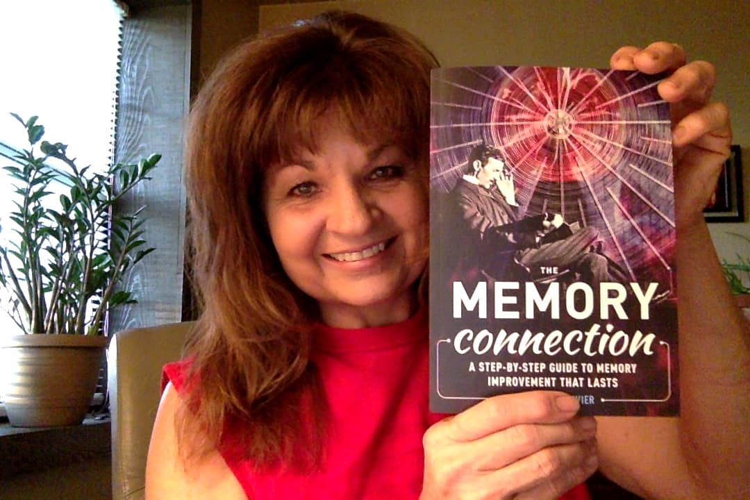 Debra with a copy of The Memory Connection by Anthony Metivier