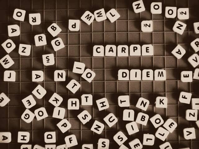 Image of Scrabble letters saying Carpe Diem to express the need to take action now with memorizing vocabulary