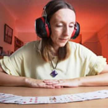 Memory Competitor Katie Kermode with a desk of playing cards
