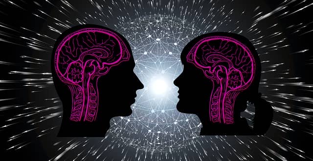 Image of two brains beaming with light to express the benefits of memory exercise
