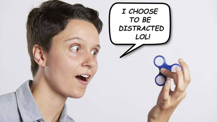 Image of a person with a fidget spinner choosing to be distracted