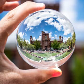 Image of a glass ball magnifying a mansion to express a concept related to the loci method