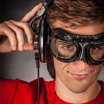 Feature image of a young man with goggles and headphones to demonstrate 3 kinds of neurobic exercise