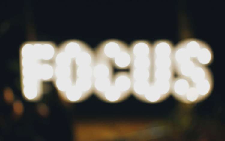 An illuminated "focus" sign; when you focus on the task at hand, it helps to build your memory.