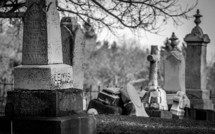 A black and white photo of a graveyard.