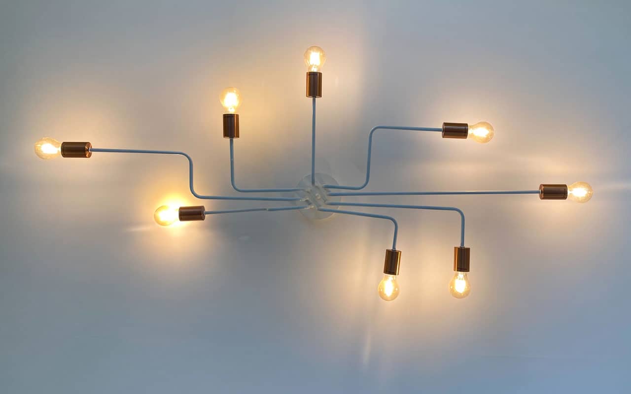 A modern light fixture in the shape of a mind map, with lights extending out in all directions.
