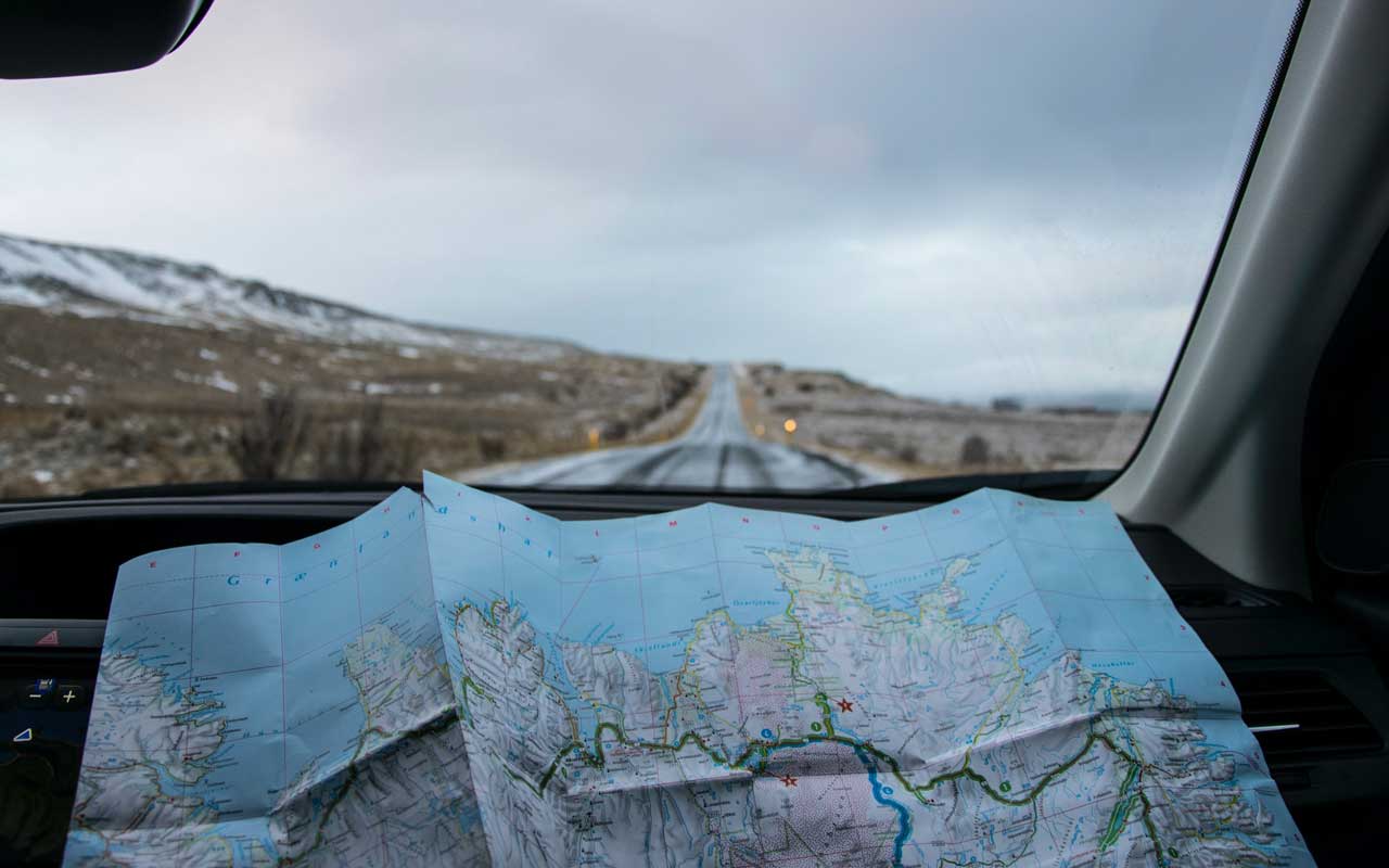 A road map against a car dashboard. Long-term memory holds things like routes you travel regularly.