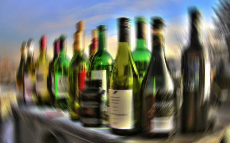 Blurry bottles, like the spinning sensation when a person has too much alcohol to drink.