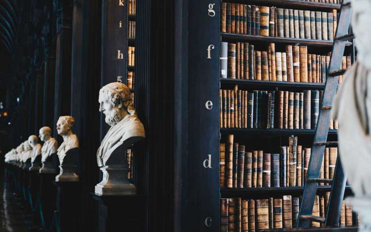 A library with busts of historical figures. Your memory strategies might include using the Dewey Decimal system as a Memory Palace.