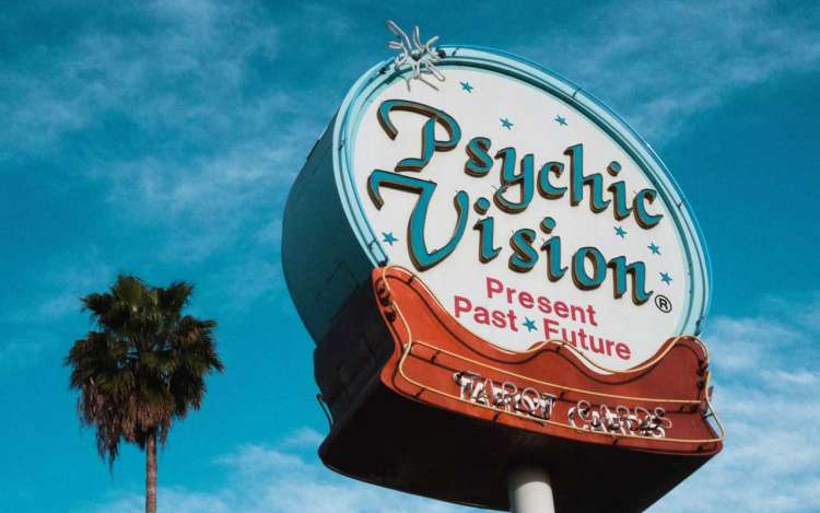 A giant sign reads "Psychic Vision, Present Past Future" - not the kind of vision we're talking about today. ;)