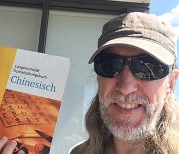 Anthony Metivier with Chinese textbook feature image for how to learn Chinese article