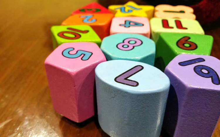 Colorful blocks with numbers painted on them. The Major Method is a powerful memory technique that helps with memorizing numbers.