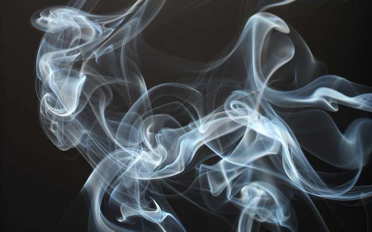 A cloud of smoke vapor hangs in the air. Smoking and vaping can impair your memory.