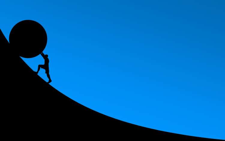 A graphic of a person pushing a large round object up an increasing slope.