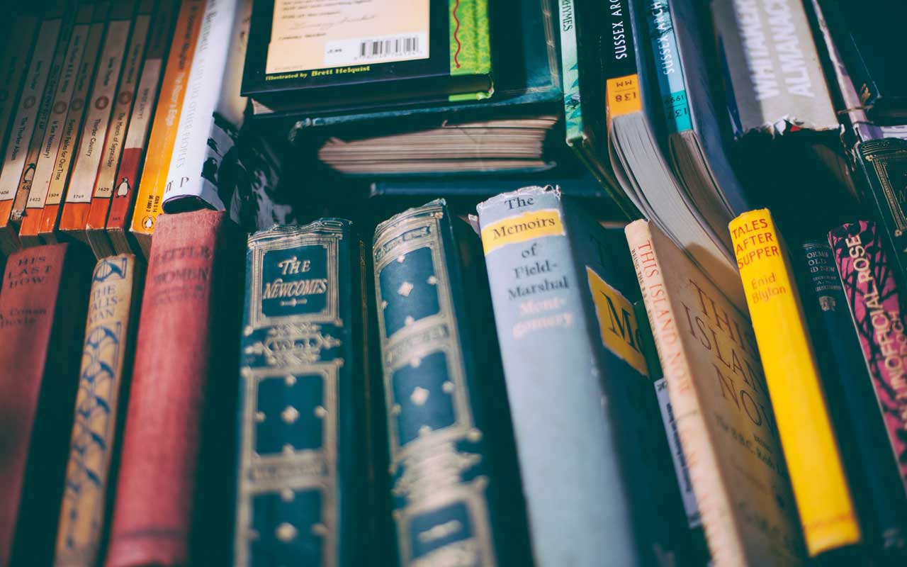 A stack of books. Reading stories can help you become conversationally fluent.