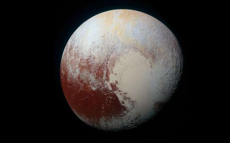 A photo of Pluto, which was previously considered a planet, until it was downgraded in 2006 to a dwarf planet.