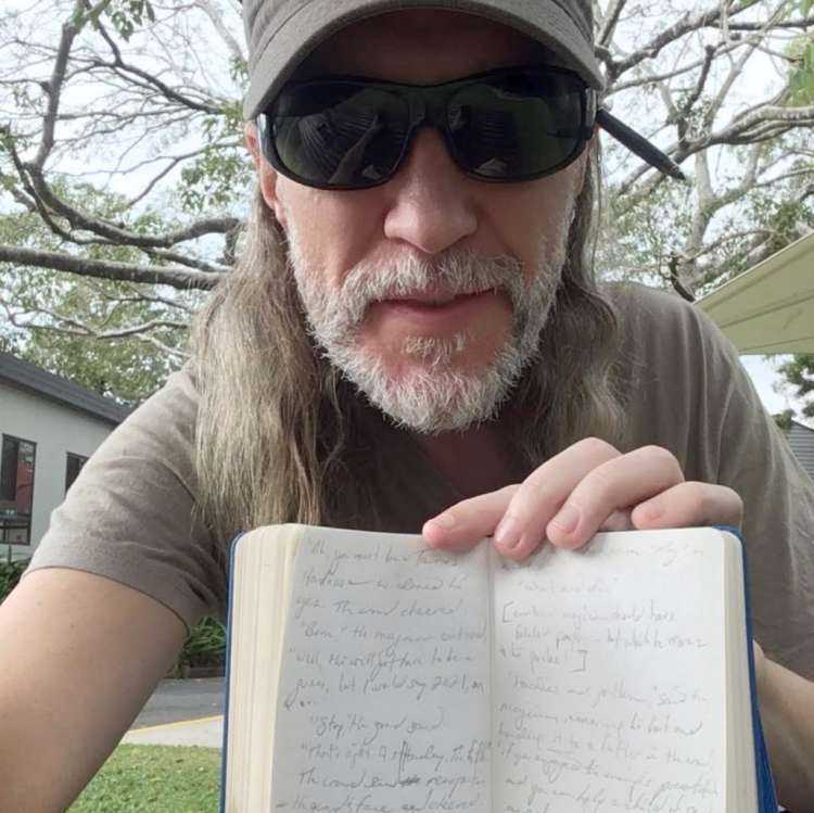 Anthony Metivier with journal