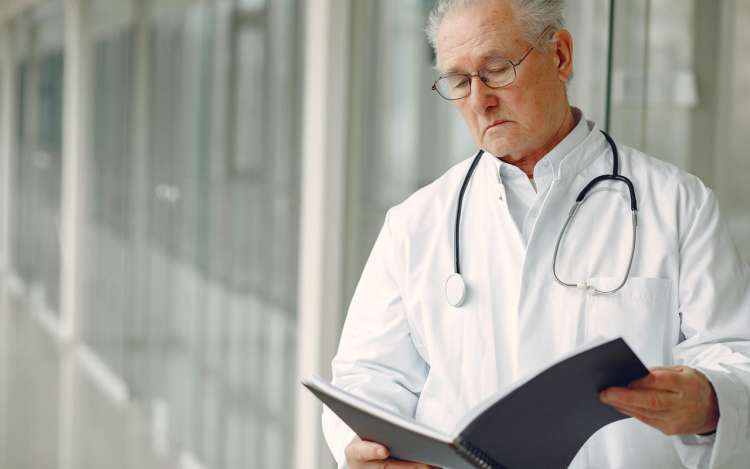 a doctor is checking documents