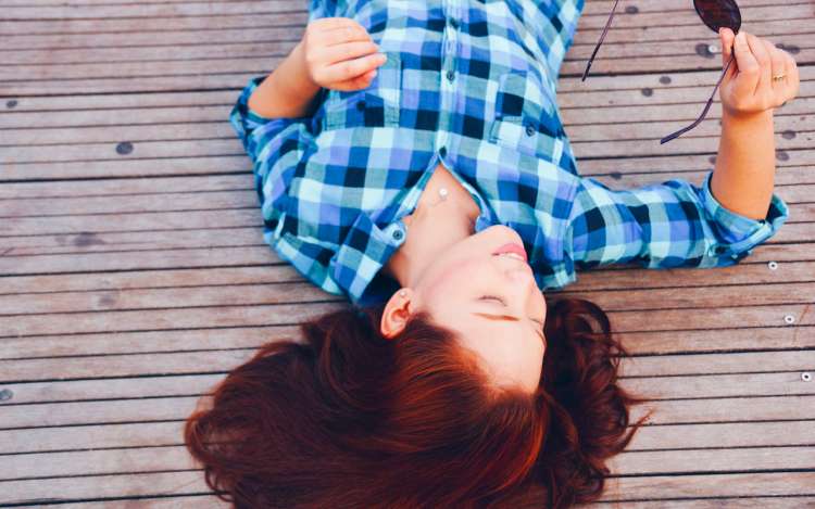 a woman is laying on the floor