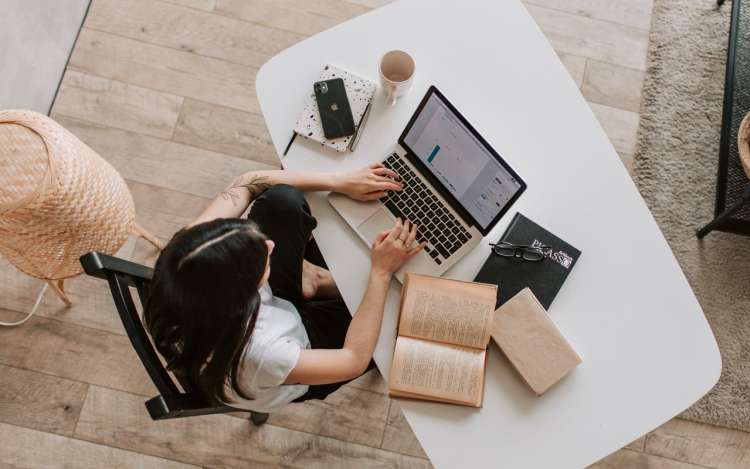 a woman is studying at home