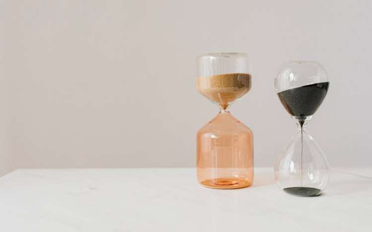 two sand timers on a table