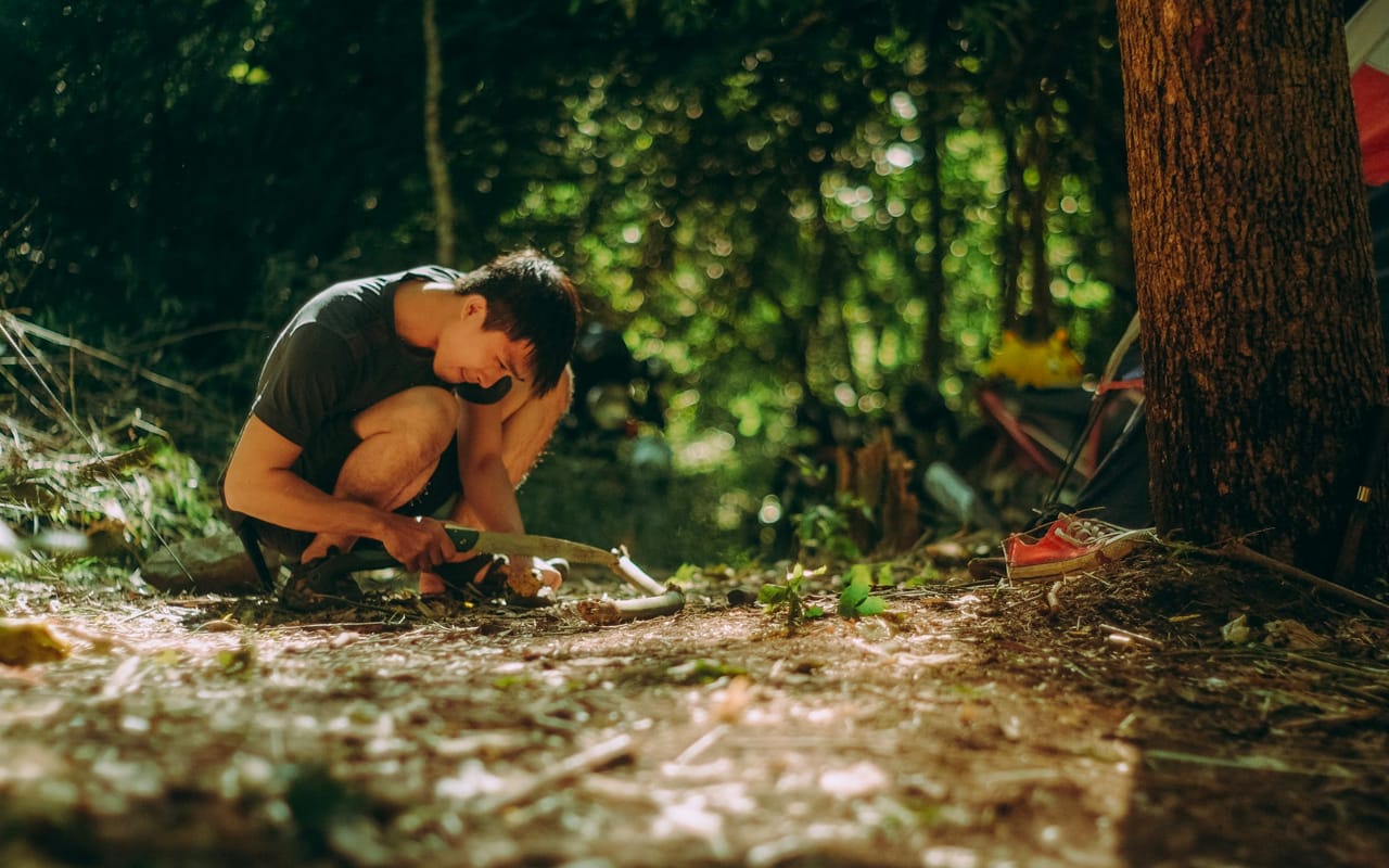 a man is cutting wood