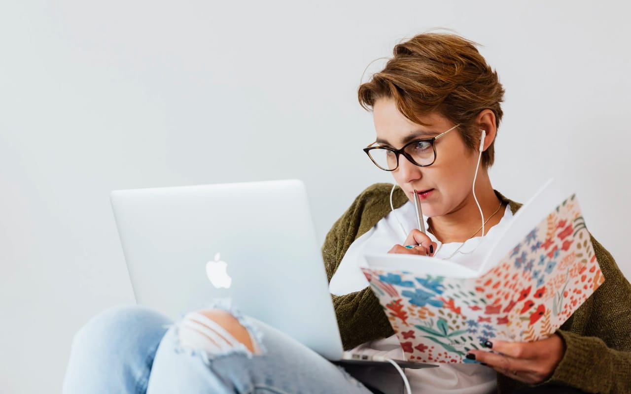 a woman is learning with her laptop