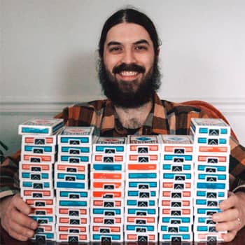Braden Adams with 70 decks of playing cards