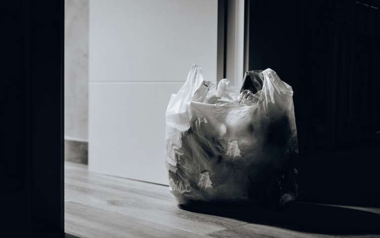 a bag of trash in door