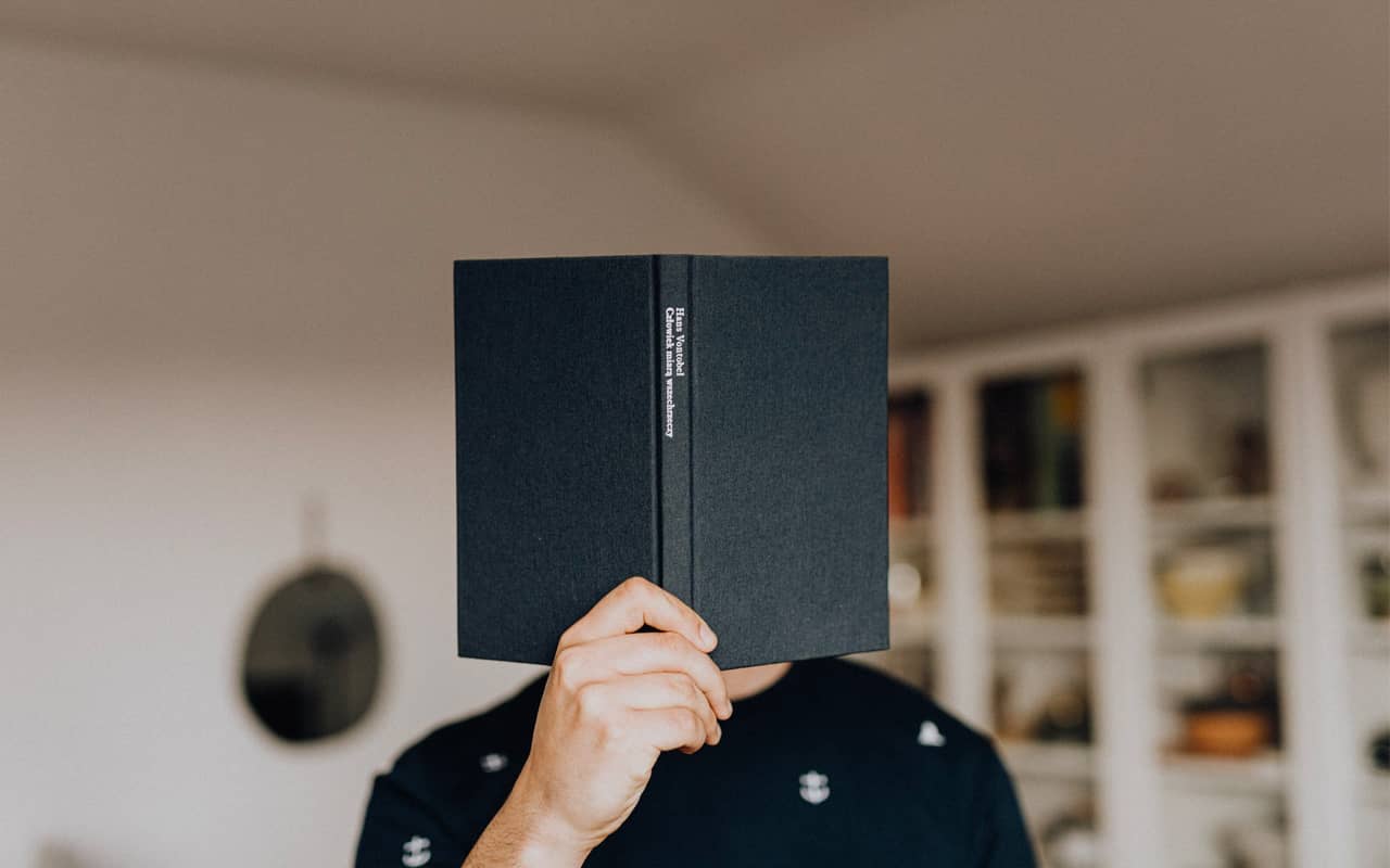 a man with a black book