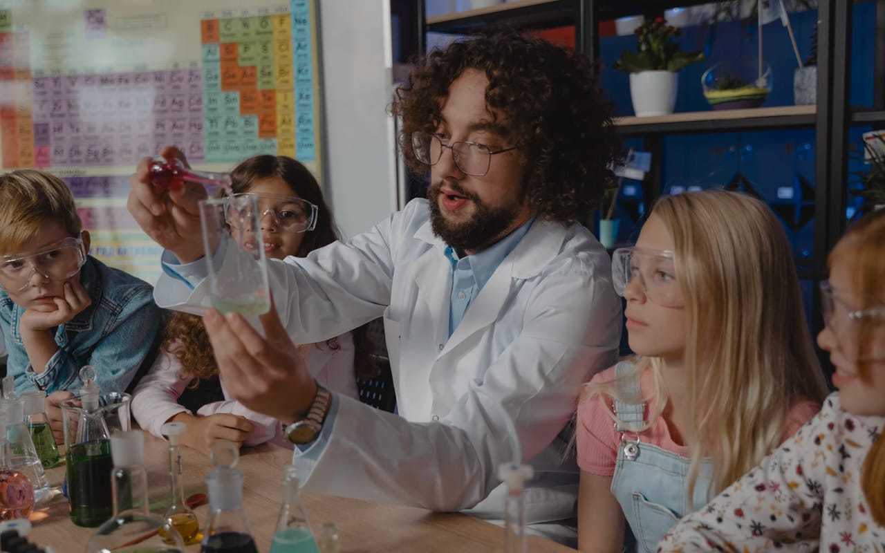 a teacher is teaching chemistry