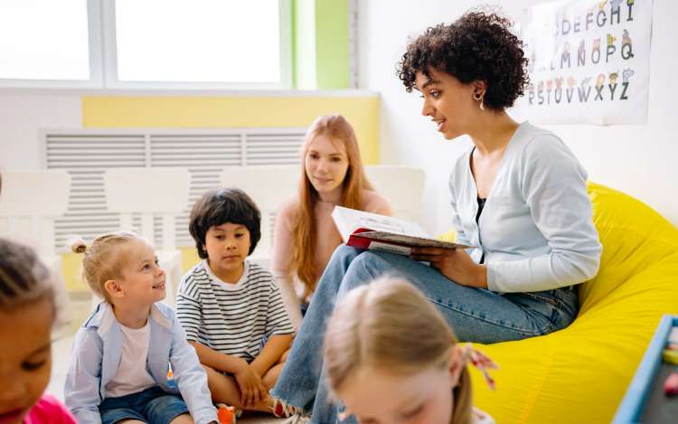 a teacher teaching kids to read