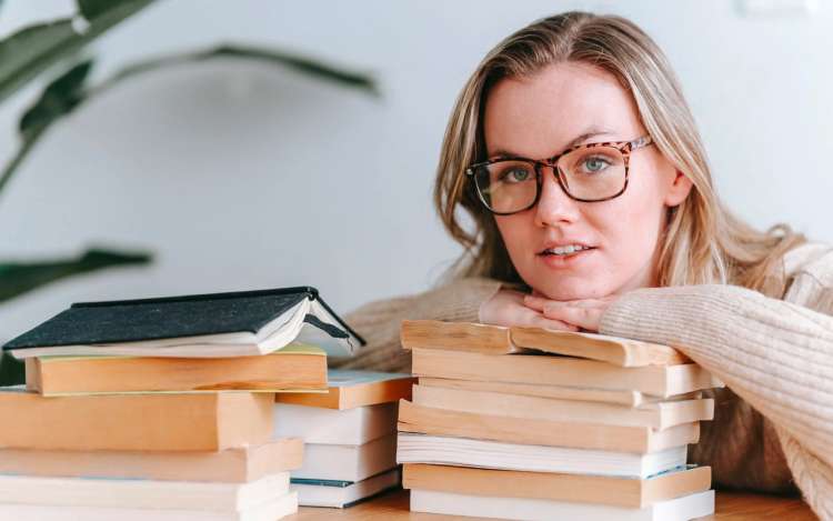 woman wears glasses and likes books