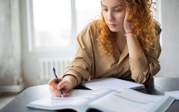 a woman focuses on her study