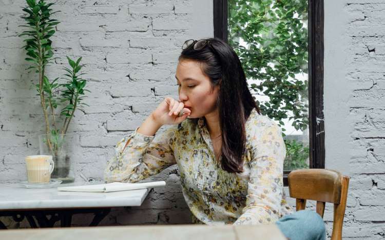 a woman is reading and thinking