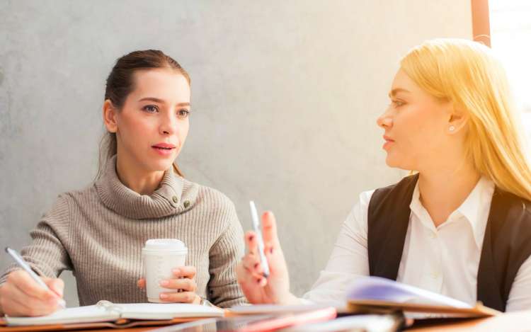 two women are discussing something