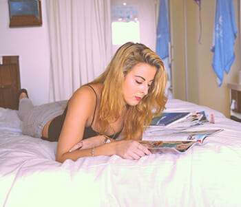 Woman reading before bed