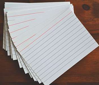 Leitner System feature image of index cards spread out on a table