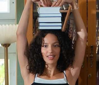 interleaving feature image of a woman with books balanced on her head
