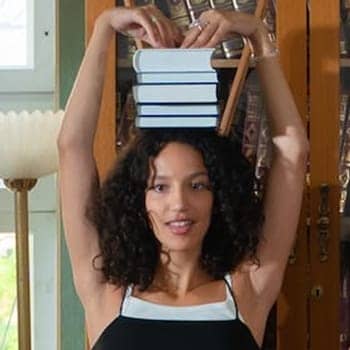 interleaving feature image of a woman with books balanced on her head