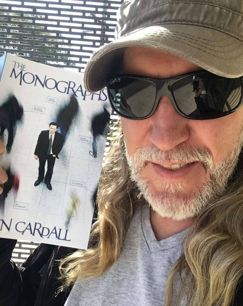 Anthony Metivier with a copy of The Monographs by Ben Cardall