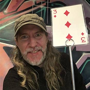 Anthony Metivier with a playing card to express a concept related to memory games for dementia